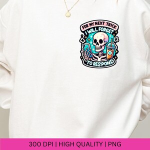 May include: White sweatshirt with a graphic of a skeleton holding a phone and a drink with the text "For my next trick I will forget to respond".