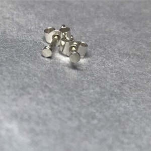 Teeny tiny silver dots ( tiny silver studs)