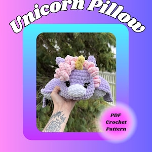 May include: A crochet unicorn pillow with a light purple body, a white muzzle, and a yellow horn. The mane features light pink and purple yarn curls. The text "Unicorn Pillow" and "PDF Crochet Pattern" are visible on the graphic background.