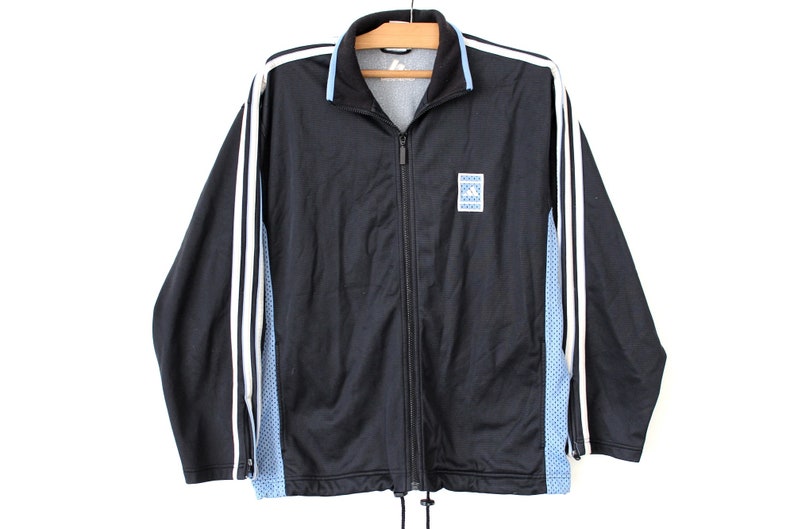 black and blue adidas tracksuit