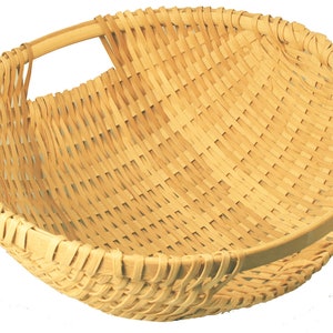 May include: A woven basket with a single handle. The basket is made of natural, light brown material and has a round shape.