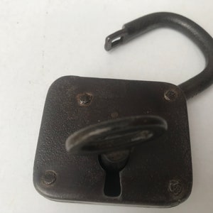 Vintage metal padlock with original key in working order lock . Symbol of love, Love you symbol