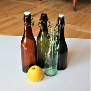 A set of 4 vintage bottles with porcelain stoppers Old beer bottles Rustic Farmhouse decor Vintage water bottles