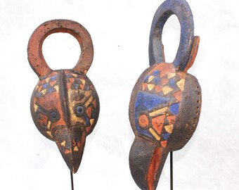 Máscaras tribales africanas vintage de aves con soportes de metal forjados a mano (juego de dos)