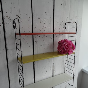 Lebber vintage® - Tomado pocket wall rack, by D. Dekker for Tomado, 1960s with bookends.