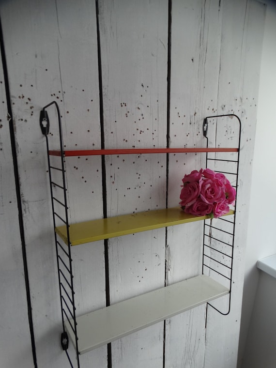 Lebber vintage® - Tomado pocket wall rack, by D. Dekker for Tomado, 1960s with bookends.