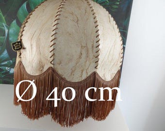 May include: A vintage lampshade with a cream-colored, textured surface and brown stitching. The lampshade has a diameter of 15.7 inches and a brown fringe at the bottom. A small tag is attached to the side.
