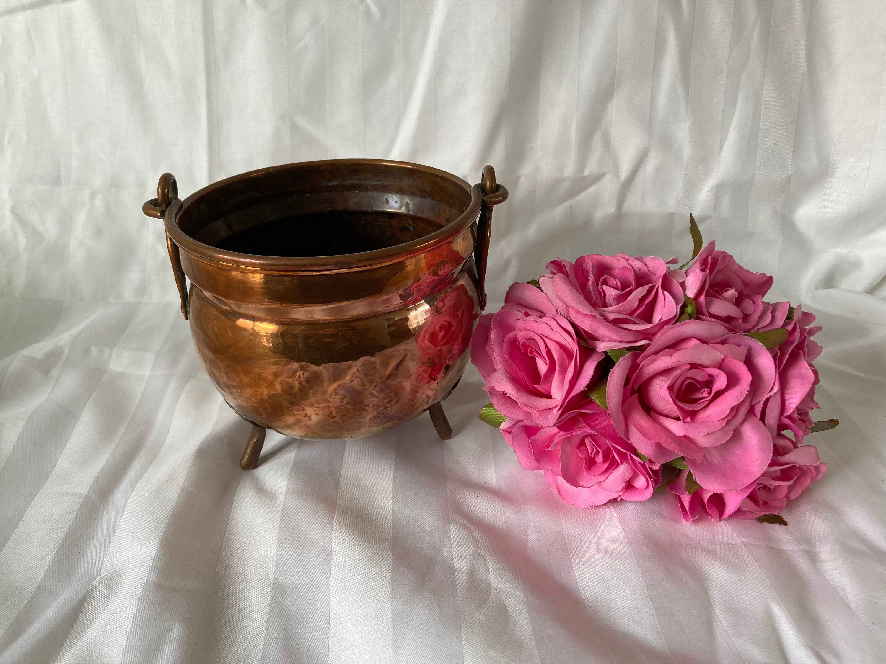 Antique copper flower pot with handle.