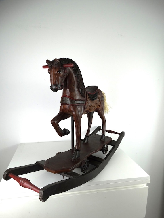 Lebber vintage® - Wooden rocking horse with glass eyes, carousel horse with painted floral details, old animal toy on wheels.