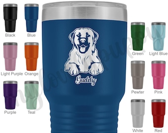 May include: A blue stainless steel tumbler featuring a white silhouette of a Labrador Retriever and the word "Buddy" engraved on it. The tumbler is surrounded by smaller tumblers in a variety of colours.