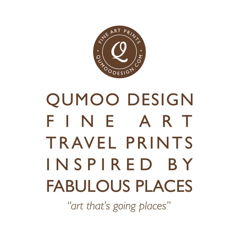 May include: A white background with brown text promoting fine art travel prints. The text reads "QUMOO DESIGN FINE ART TRAVEL PRINTS INSPIRED BY FABULOUS PLACES". A circular logo at the top says "FINE ART PRINTS" and "QUMOODESIGN.COM". The tagline is "art that's going places".