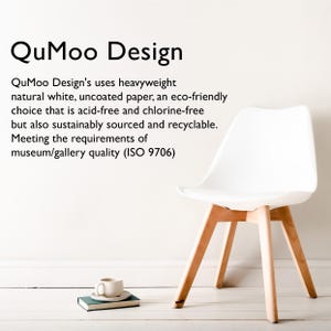 May include: A white chair with a curved back and wooden legs. A small cup and saucer rest on a book. The image includes the text "QuMoo Design", detailing the paper's eco-friendly qualities.