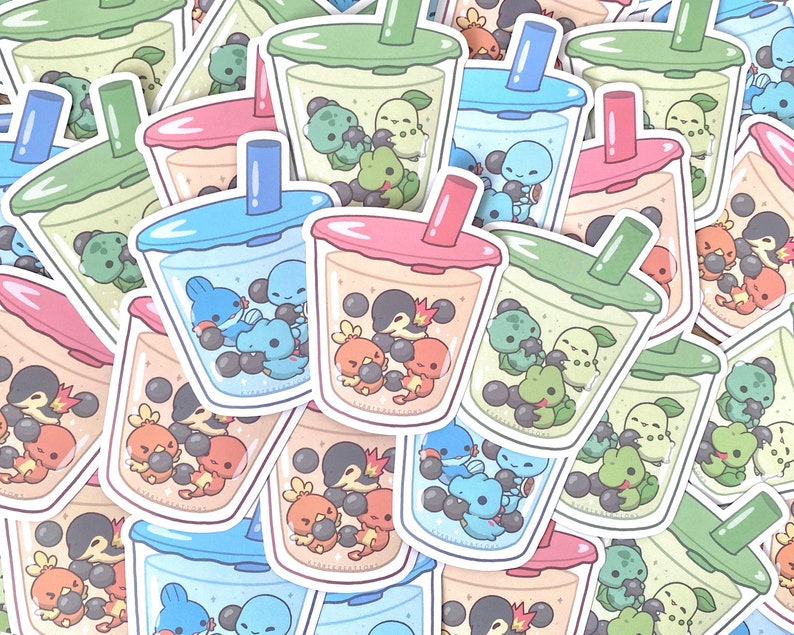 May include: A collection of colorful bubble tea stickers featuring various cartoon characters. Each sticker depicts a clear plastic cup filled with boba pearls and a cartoon character, such as a turtle, a penguin, or a fish.