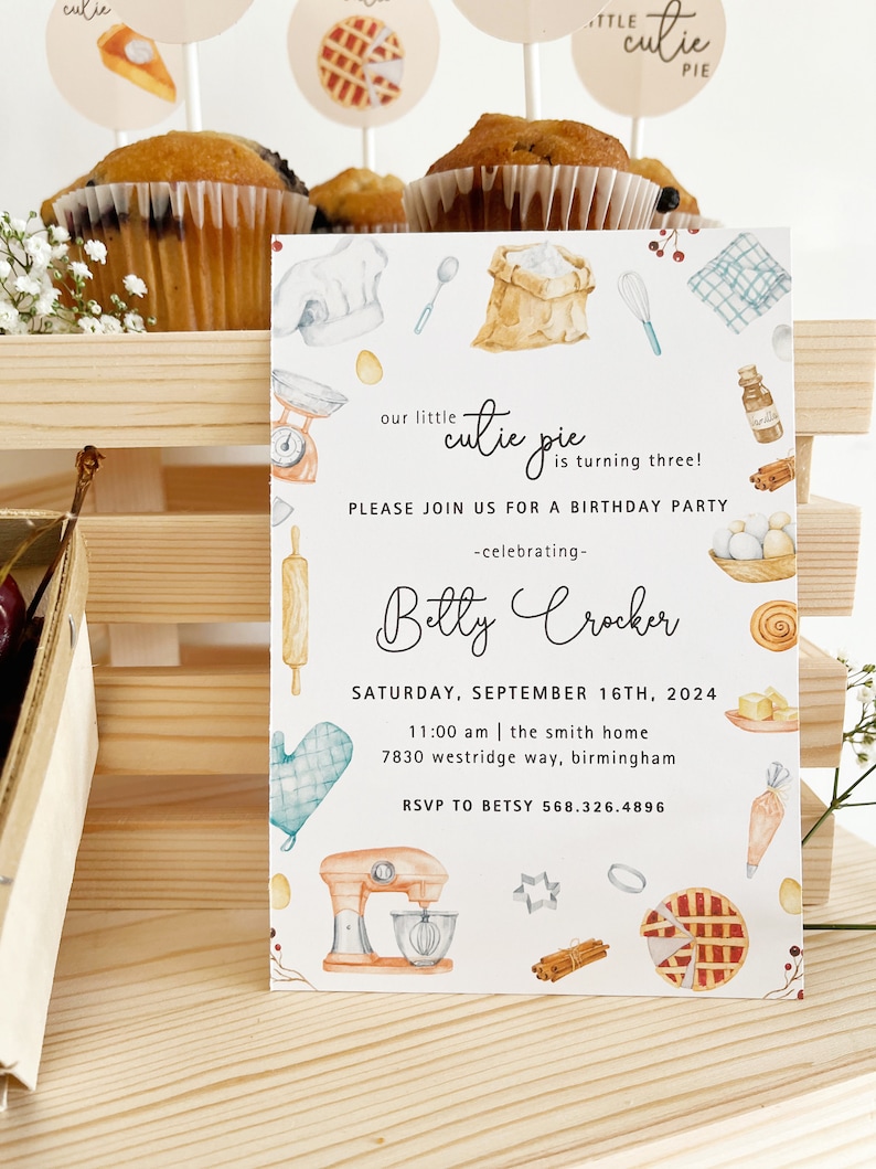 May include: A white invitation card with a watercolor illustration of baking supplies, including a mixer, rolling pin, and a pie. The text on the card reads "our little cutie pie is turning three!" and includes the name "Betty Crocker" and details for a birthday party.