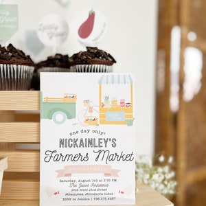 May include: A colorful invitation for a birthday party with the text "Nickainley's Farmers Market Birthday Bash". The invitation features a cartoon illustration of a farmer's market stand with a truck and a bicycle. The invitation includes the date, time, location, and RSVP information.