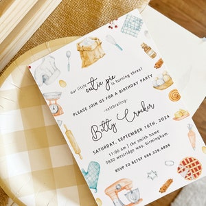 May include: A white invitation card with a watercolor illustration of baking supplies, including a rolling pin, a mixing bowl, a whisk, a bag of flour, and a pie. The text on the card reads "our little cutie pie is turning three! Please join us for a birthday party -celebrating- Betty Crocker Saturday, September 16th, 2024 11:00 am | the smith home 7830 westridge way, birmingham RSVP to Betsy 568.326.4896".