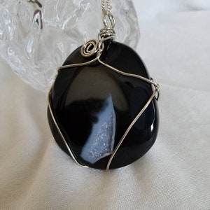 Every Onyx has a Geode Lining Pendant, Black Onyx Pendant with Grey Druzy Accent Crystals in a Silver Spiral Setting