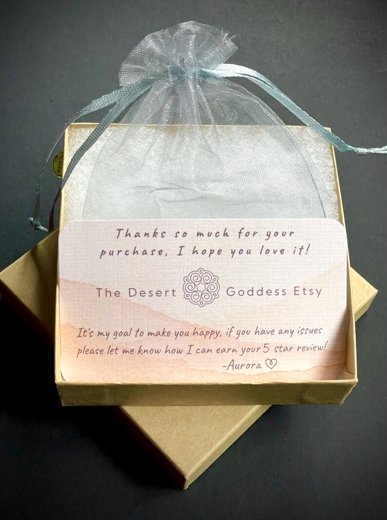 May include: A small, brown cardboard box with a light blue organza bag on top. The box contains a thank you card with the text "Thanks so much for your purchase, I hope you love it! The Desert Goddess Etsy It's my goal to make you happy, if you have any issues please let me know how I can earn your 5 star review! -Aurora"