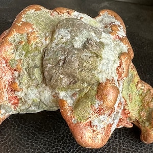 May include: A large, irregularly shaped piece of copper ore with a rough, textured surface. The ore is a mix of copper, green, and white colors.