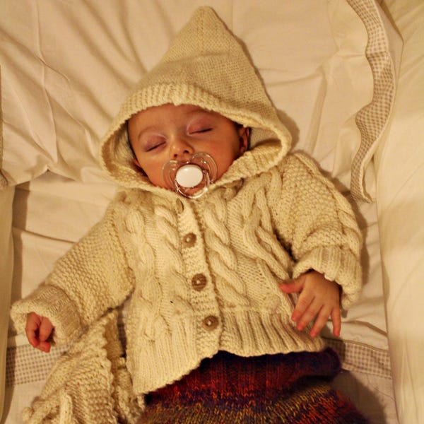 Handmade newborn sweater in Merino. handknitted cable baby sweater