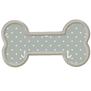 May include: A gray bone-shaped embroidery design with white polka dots and a small anchor on each end.