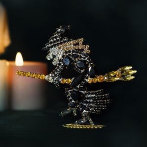 Witch on Broom Halloween Decor (Black, Gold), Handcrafted Scintillating witch Halloween decoration.