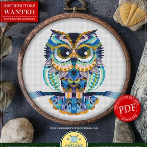 May include: A counted cross stitch pattern for an owl with a mandala design. The pattern is in a wooden embroidery hoop and is available as a PDF download. The pattern is 7.13 inches by 6.50 inches and uses 18 colours of DMC thread.