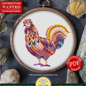 May include: A cross-stitch pattern of a rooster in a wooden hoop. The rooster is a mandala design with orange, pink, purple, and blue hues. The text "COUNTED CROSS STITCH PATTERN" and "Mandala_Chicken" are visible. The fabric size is 15.88 cm x 15.88 cm.