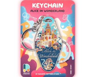 May include: A motel-style keyring featuring an Alice in Wonderland design with a castle, mushrooms, and the text Alice in Wonderland. The keyring is attached to a metal ring and presented on a colourful backing card with the text KEYCHAIN.