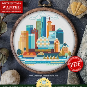 May include: Counted cross stitch pattern for instant download of a colorful cityscape with the text "№ C610 Vancouver" and "DISTRIBUTORS WANTED FOR PRINTED SCHEMES". The pattern is in a wooden embroidery hoop and is 8.37 x 8.31 inches, or 134 x 133 stitches. The pattern is for Aida 16 count fabric and uses 18 DMC colors.