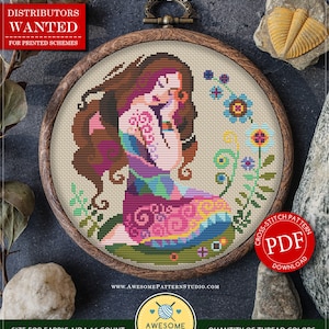 May include: A cross-stitch pattern featuring a seated woman with long brown hair, wearing a colorful dress, surrounded by flowers. The design is set within a wooden embroidery hoop. The text reads "Virgo" and "PDF Download". The pattern size is 6.56 x 6.75 inches.
