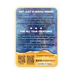 May include: A rectangular, rounded-corner card with text in white and a watercolor-style blue and yellow background. The card reads "NOT JUST A NEEDLE MINDER" and promotes patterns and kits for embroidery, cross stitch, beading, and diamond painting.
