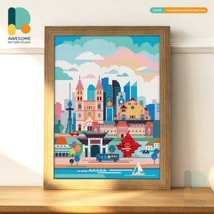 May include: A pixel art illustration of a city skyline with colorful buildings, a river, and boats. The skyline includes a church, a tower, and a red bridge. The illustration is framed in a wooden frame.