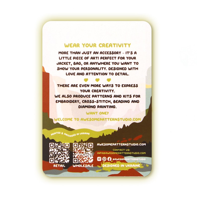 May include: A rectangular card with a colorful design and text. The card features the text "WEAR YOUR CREATIVITY" and promotes embroidery, cross-stitch, beading, and diamond painting kits. The card is designed in Ukraine.