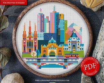 May include: A cross stitch pattern for a colorful cityscape of Melbourne, Australia. The pattern is in a wooden embroidery hoop and includes 18 colors. The pattern is available as a PDF download. The pattern is 6.06 inches by 6.19 inches and uses 97 x 99 stitches.