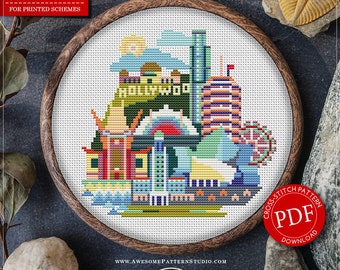 May include: Counted cross stitch pattern for instant download of a colorful Los Angeles skyline with the Hollywood sign, featuring 19 different thread colors. The pattern is 83 stitches wide by 90 stitches high, and is suitable for Aida fabric with a 16 count.