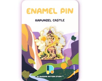 May include: Enamel pin with a Rapunzel castle design. The pin is gold, pink, and purple with a white cloud and sun. The card reads "ENAMEL PIN" and "RAPUNZEL CASTLE". The background has a landscape design with trees and hills.