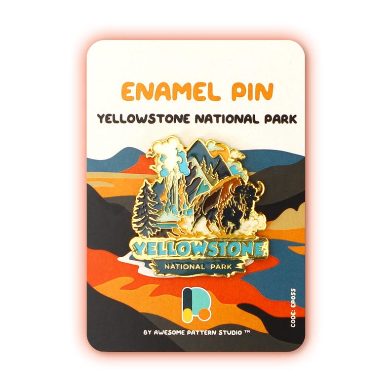 May include: Yellowstone National Park enamel pin featuring a gold bison, a blue geyser, and a green pine tree. The pin is on a card with the text "Yellowstone National Park" and "By Awesome Pattern Studio TM".
