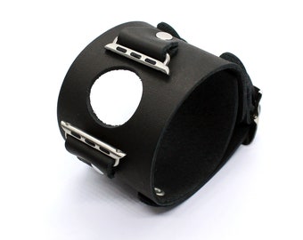 May include: Black leather watch band with a cutout for a watch face and silver metal clasps.