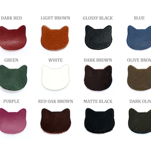 May include: Twelve leather cat-shaped patches in various colors, including dark red, light brown, glossy black, blue, green, white, dark brown, olive brown, purple, red oak brown, matte black, and dark olive.
