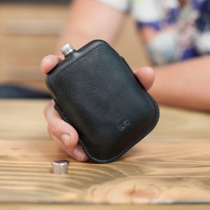 Personalised matt black hip flask with leather sleeve