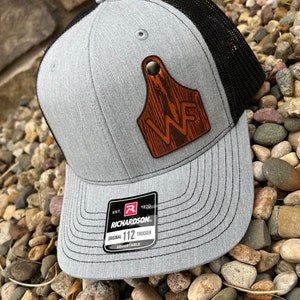 Custom Richardson 112 Laser Engraved Leather Patch Hat- Logo Cattle Ear Tag Livestock Farm with Rivot Wood grain background