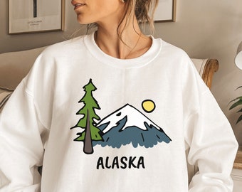 Felpa Alaska, girocollo unisex con grafica retrò di montagna, idea regalo Alaska, stile vintage, possibilità di personalizzazione.
