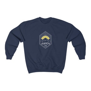 May include: Navy blue sweatshirt with a white graphic of a mountain range and a sun with the text "ASPEN CO" in a hexagon.
