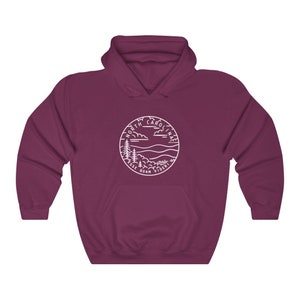 May include: A maroon hooded sweatshirt with a white outline of a circle containing the words "North Carolina" and a landscape scene with mountains and trees. The text "Esse Quam Videri" is written below the circle.