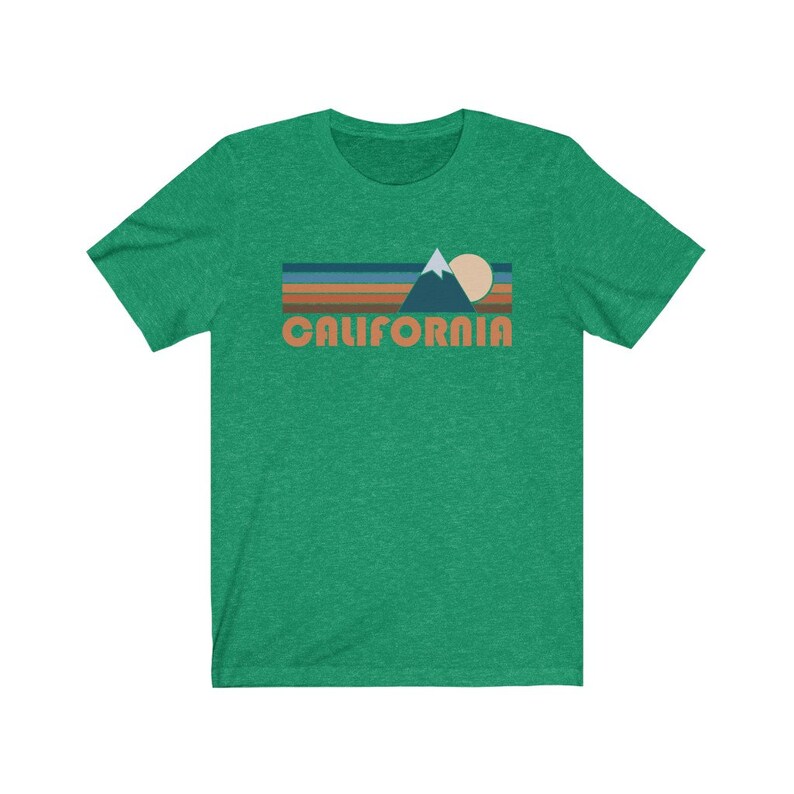May include: A green t-shirt with a retro-style graphic of a mountain range, sun, and the word "CALIFORNIA" in orange.