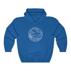 May include: Royal blue hooded sweatshirt with a white outline of a North Carolina state seal featuring a mountain range, trees, and the words "North Carolina Esse Quam Videri".