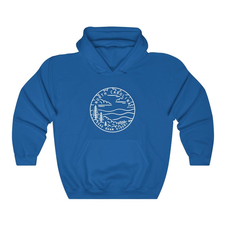 May include: Royal blue hooded sweatshirt with a white outline of a North Carolina state seal featuring a mountain range, trees, and the words "North Carolina Esse Quam Videri".