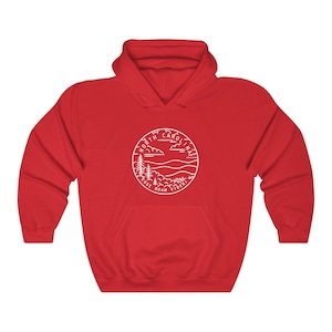 May include: Red hooded sweatshirt with a white outline of a circle containing the words "North Carolina" and "Esse Quam Videri" with a mountain and tree design.