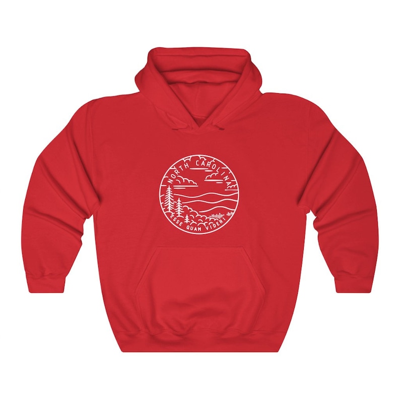 May include: Red hooded sweatshirt with a white outline of a circle containing the words "North Carolina" and "Esse Quam Videri" with a mountain and tree design.